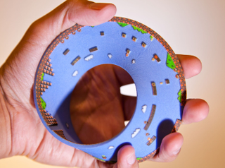 Illustration for article titled Super Mario Bros. Level 1 Recreated On A...Mobius Strip?